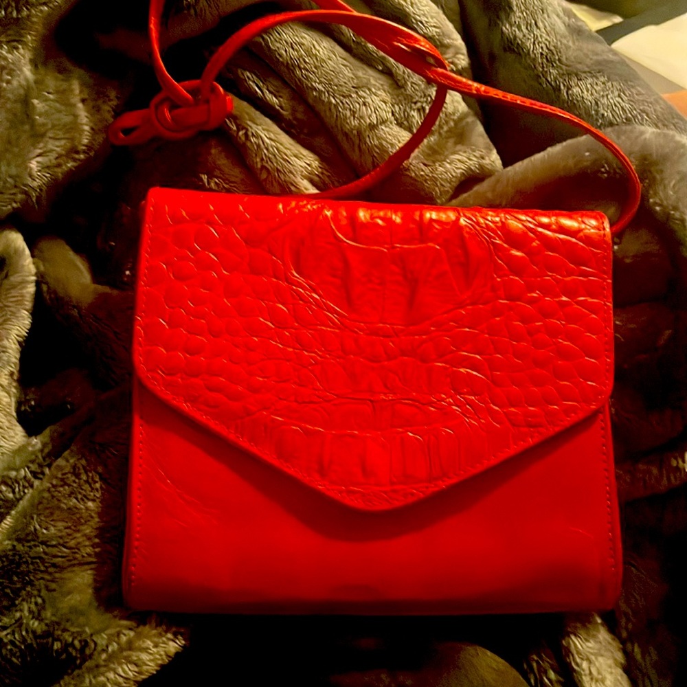 A Portofino red leather bag Used in excellent cond. inside spotless 61/2 X 71/2